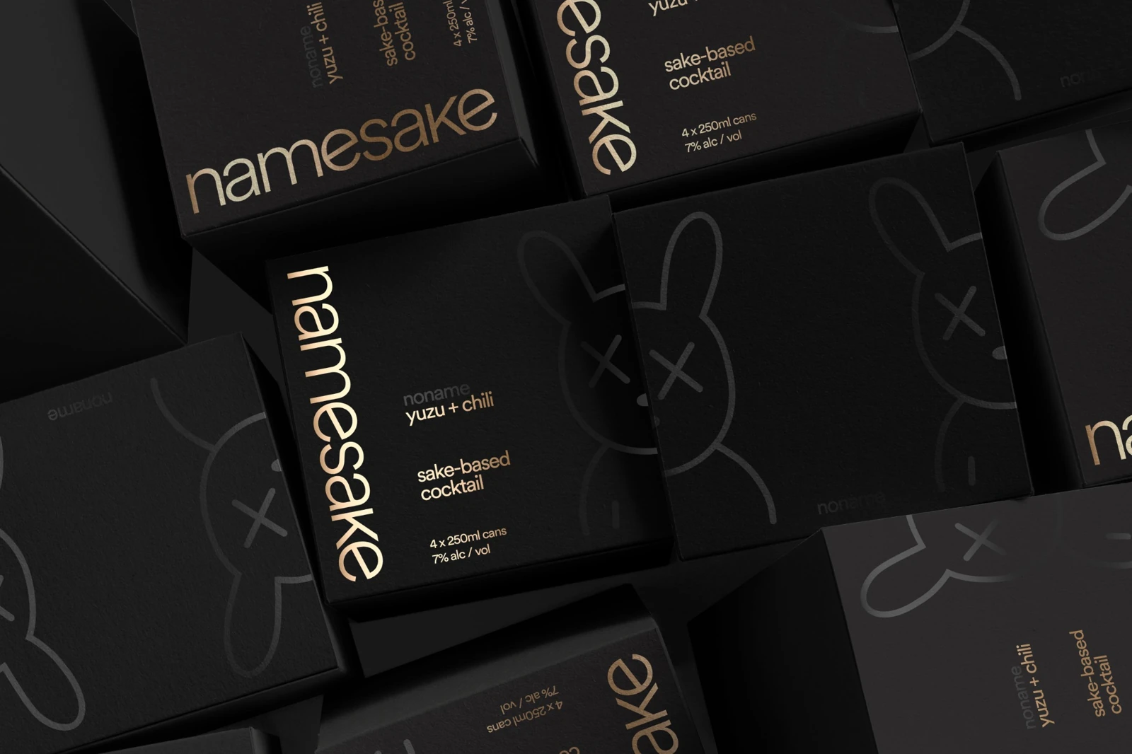 NameSake black and gold four-pack carriers, with the signature rabbit illustration